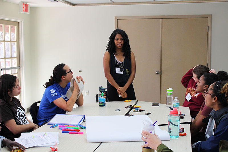 A LOGIC participant presenting during a group exercise.