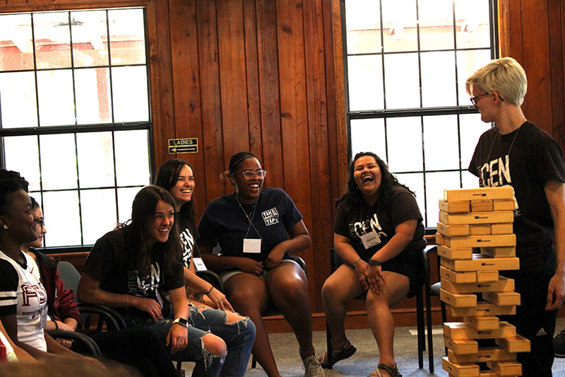 LOGIC participants laughing as a fun game is being prepared.